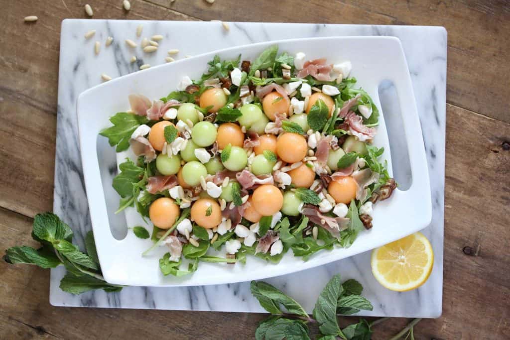 Salad on white serving platter.