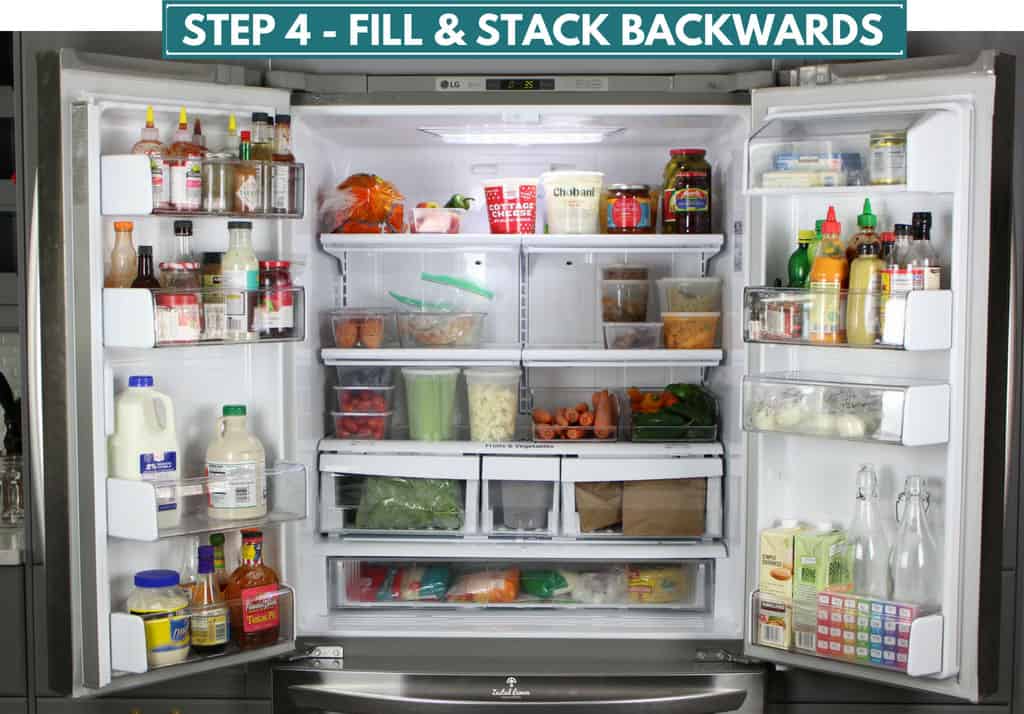 Open double door refrigerator with organized food.