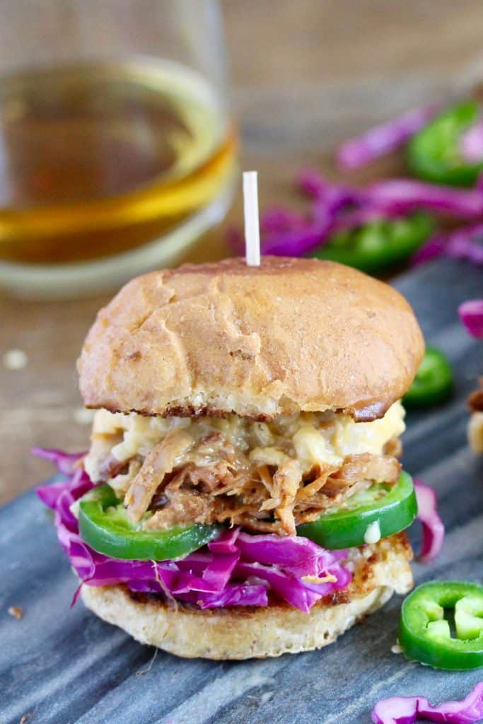 Pork slider on grey cutting board.