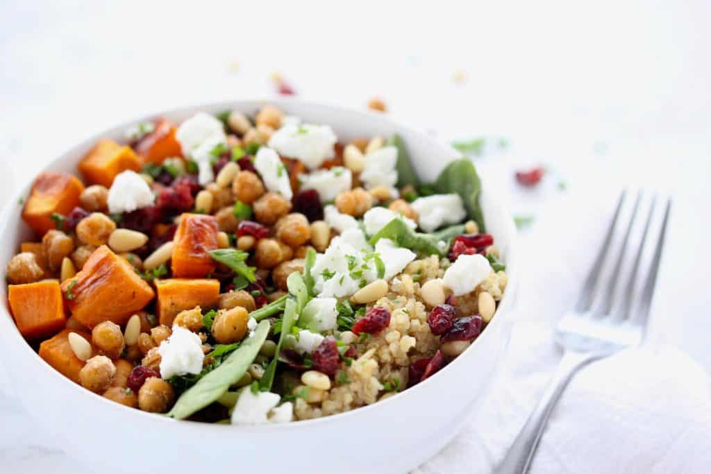 Sweet potato and quinoa salad in white bowl.